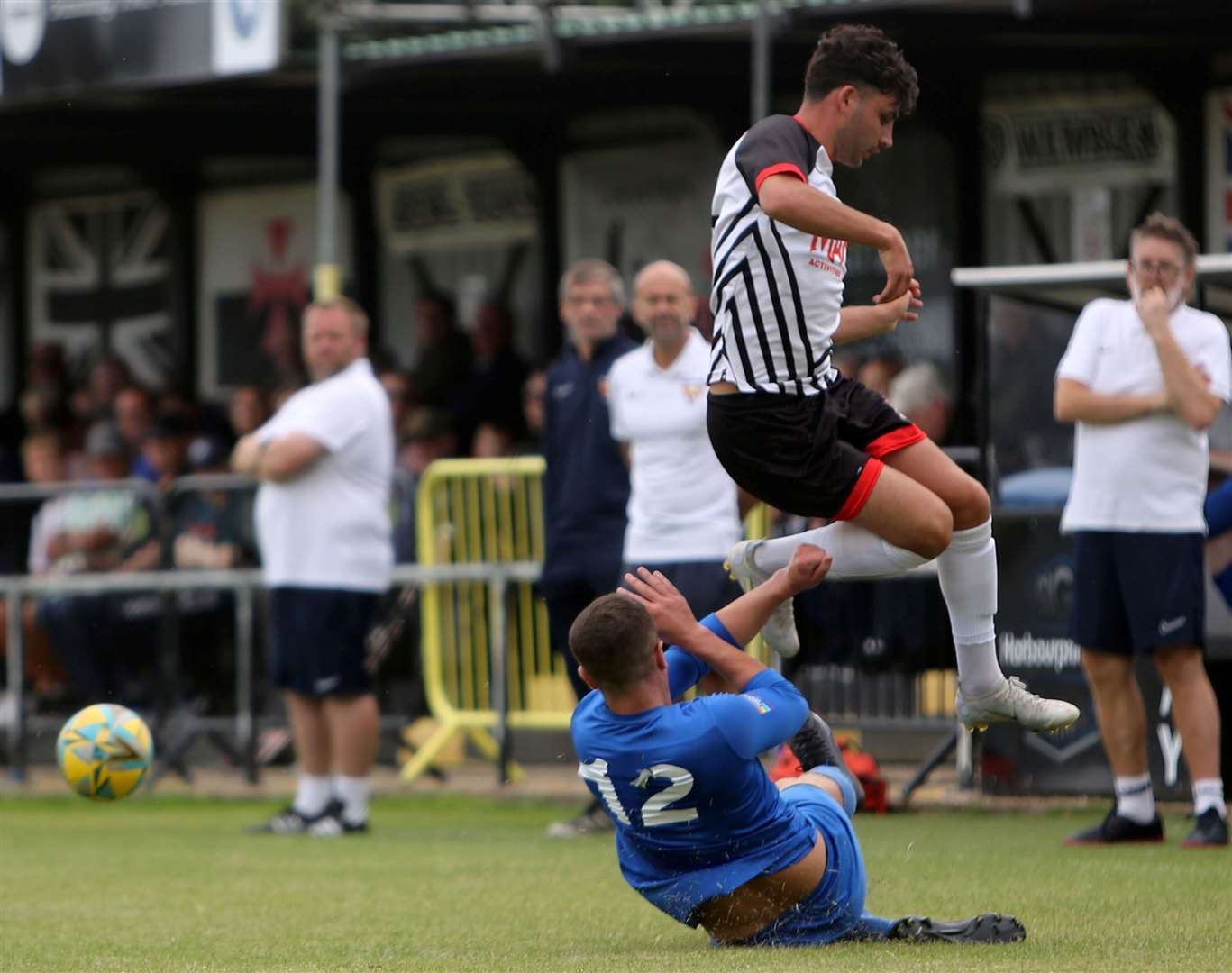 Jack Penny, of Deal, is denied the opportunity to cross by a Faversham Strike Force player. Picture: Paul Willmott