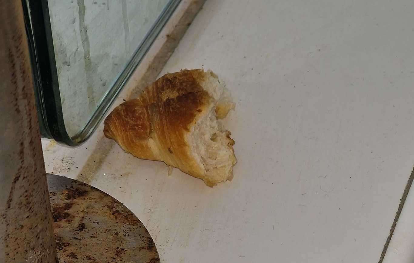 A half-eaten croissant was spotted next to the pools