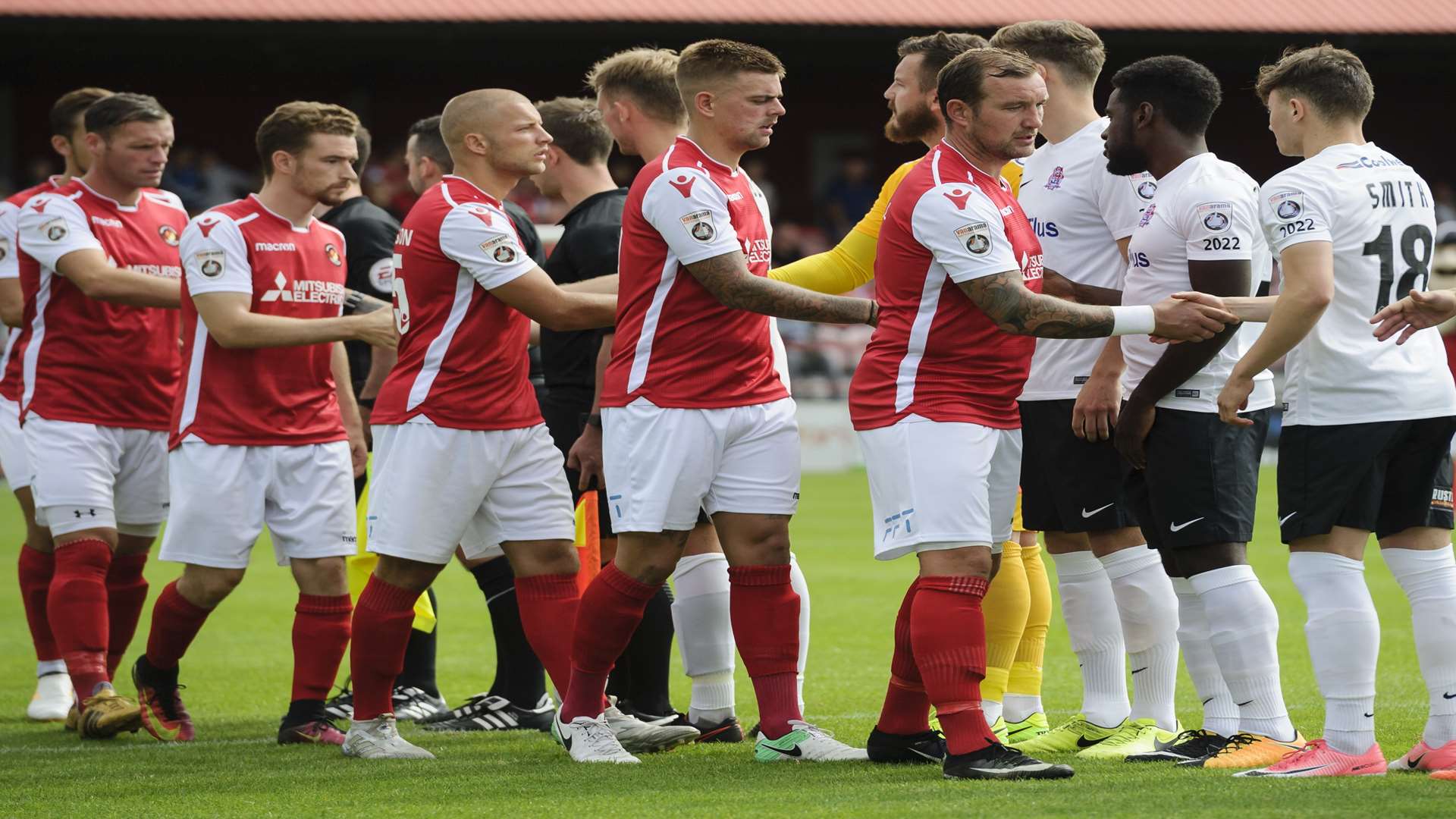 Danny Kedwell leads the pre-match handshakes. Picture: Andy Payton