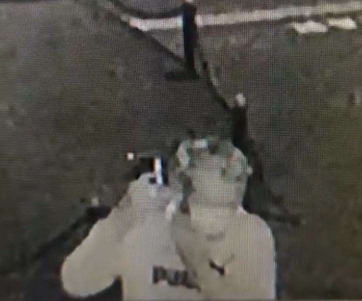CCTV shows a man stopping to put on a mask and a hoodie near TJ's E-cigarettes store in Leysdown