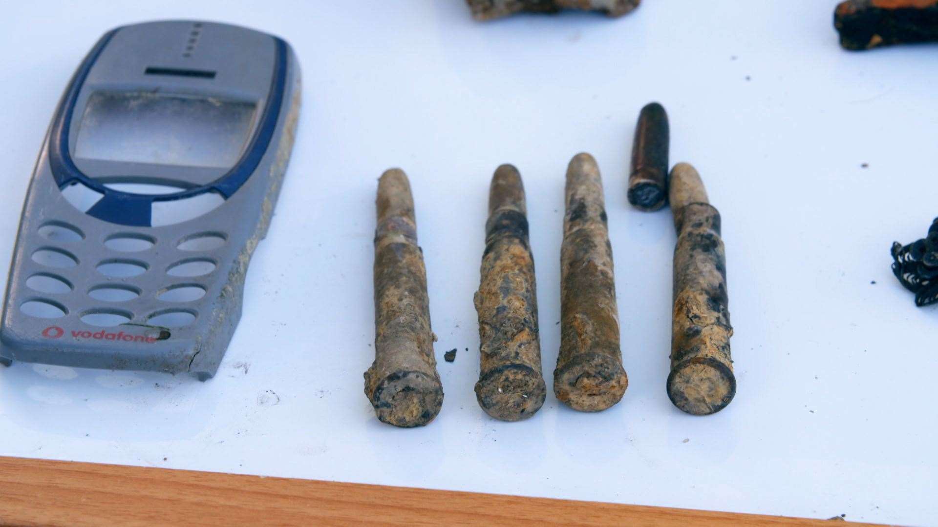 Bullets were found on the riverbed... along with a Nokia phone