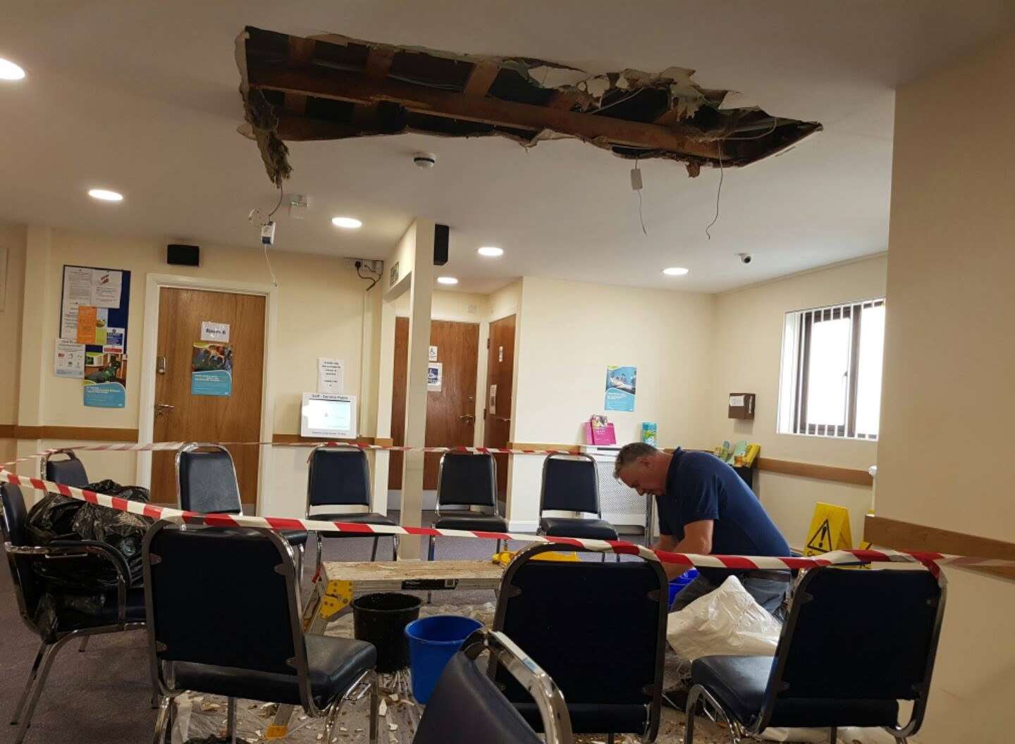 A witness reported seeing dust and water pouring from the ceiling of The Shepway Medical Centre today