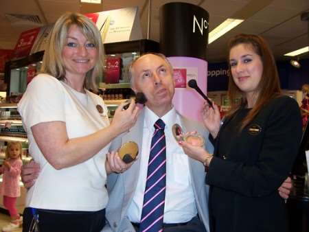 Sue Young and Jade Ansell from Boots beautify KM Big Quiz questionmaster Michael Claughton to promote the charity event.