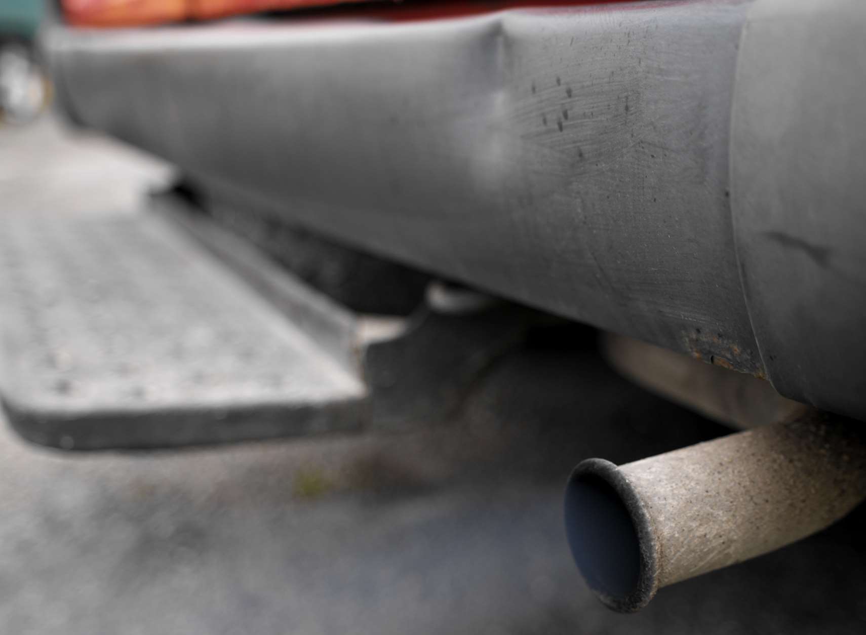 A car exhaust pumping out of fumes. Stock image