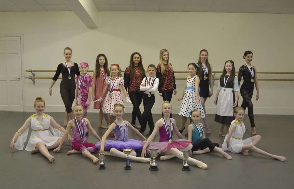 Dancers from Hasland Dance Studios proudly display their medals and trophies