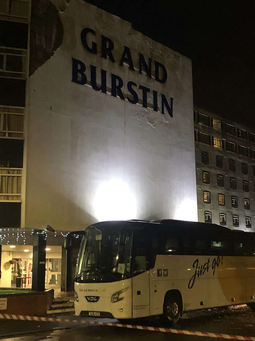 The fallen facade fell on a coach outside the hotel's entrance. Picture: Jenson Bailey