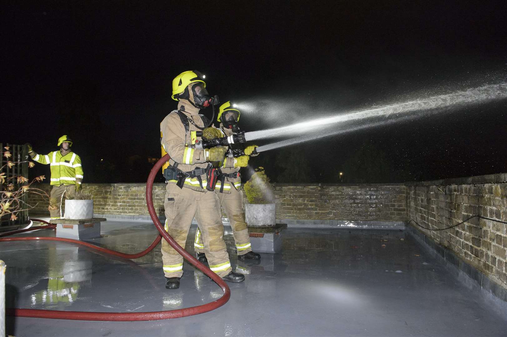 Firefighters used breathing apparatus and high-pressure hoses like these to put out the fire.