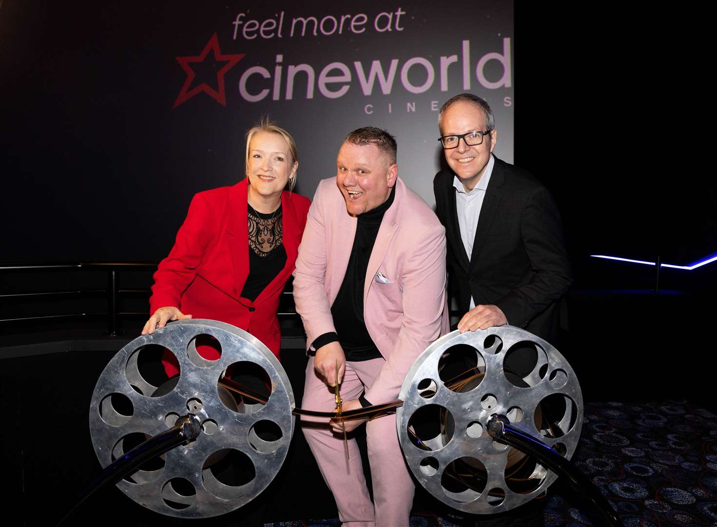 Kelly Drew, Cineworld Operations Director with Ashford's General Manager Gary Cork and John Schreiner, IMAX SVP, Theatre Development cutting the ribbon. Picture: Andrew Fosker / PinPep