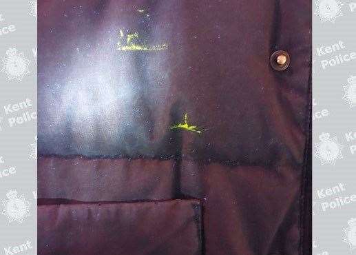 The marks on the body warmer showed up under UV light after the man came into contact with the victim's windows. Picture: Kent Police