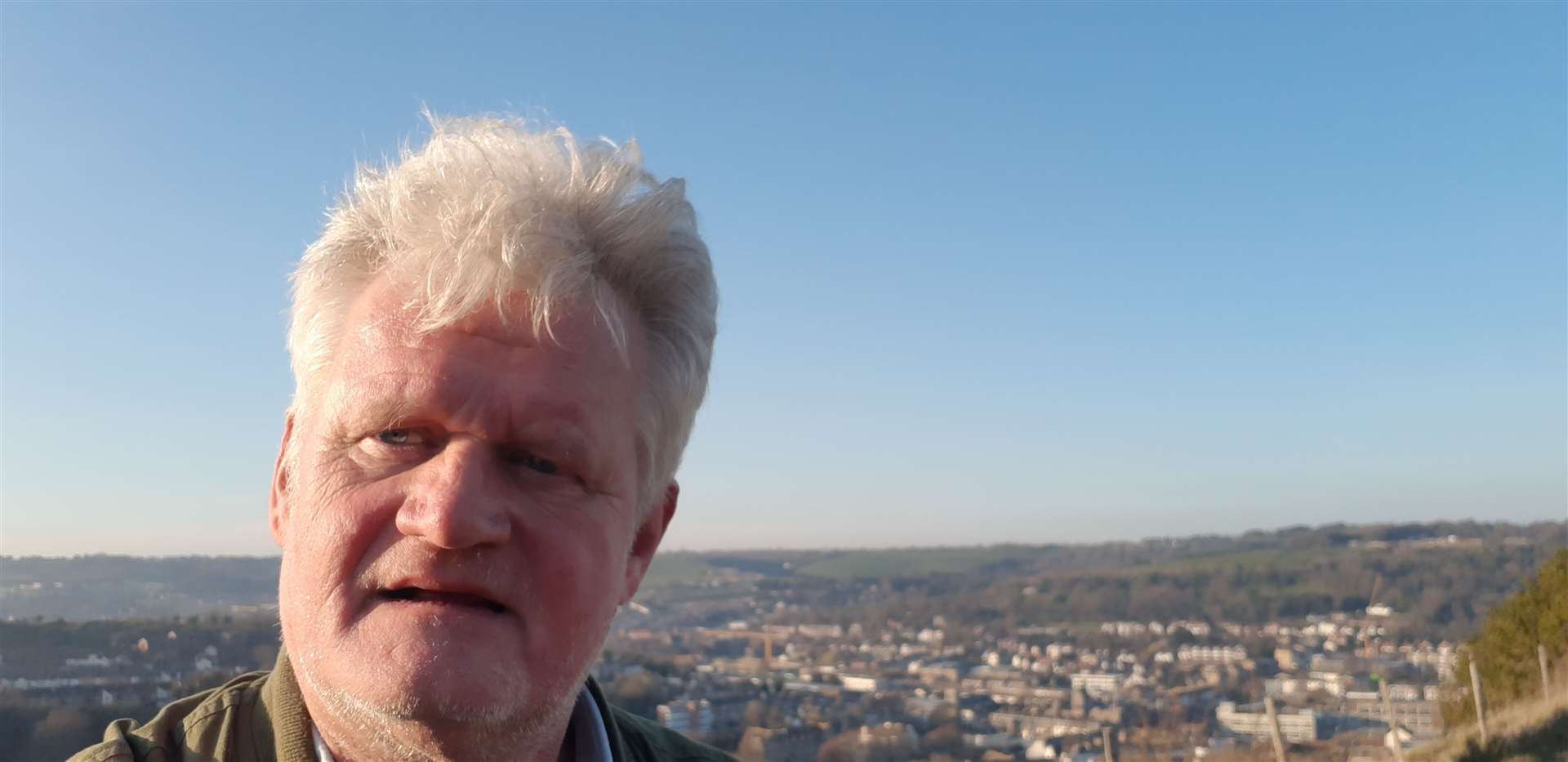 Sam Lennon hillwalking on the Western Heights with the Folkestone Road and Elms Vale area below