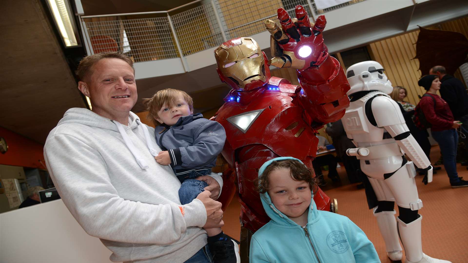 Paul Laker with Finley, four, and Franky, two, meet Iron Man at the Folkestone Film, TV and Comic Con