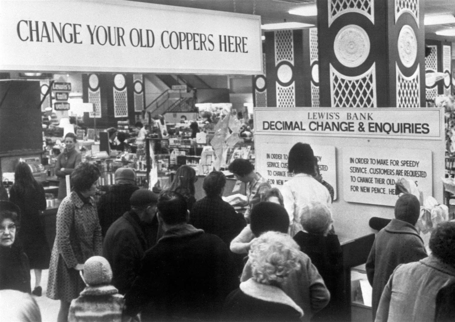 The banking section of Lewis’s department store in Manchester changes old coins in 1971 (PA)