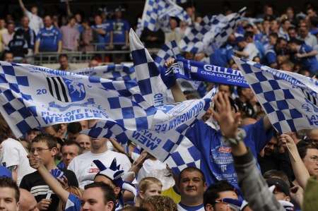 Gillingham fans celebrate the club's play-off win at Wembley