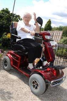 Rita Turner, who's driving round Brands Hatch in her mobility scooter.