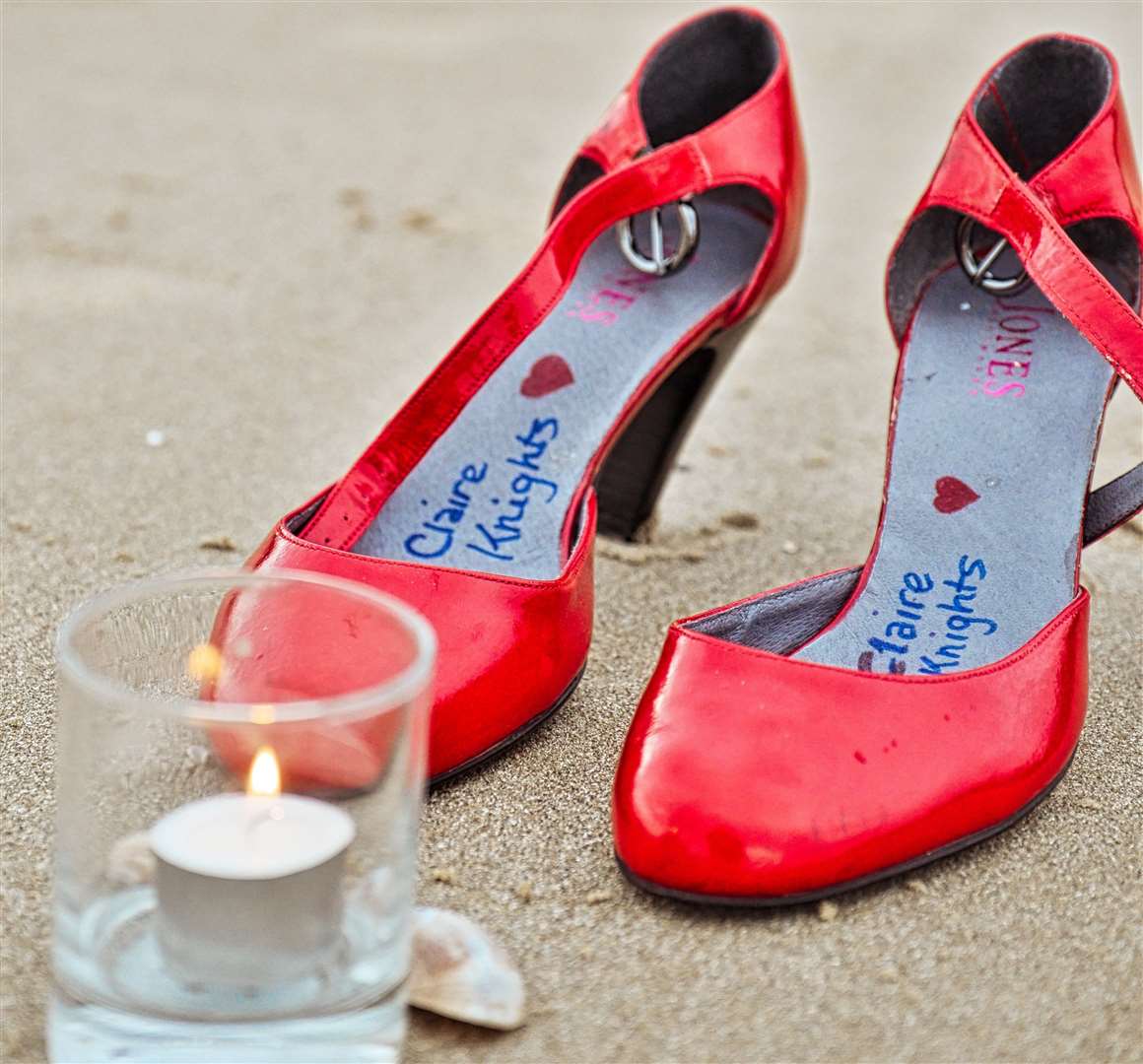 One set of shoes was put out with Claire Knights’ name in, alongside a candle. Picture: Matthew Page
