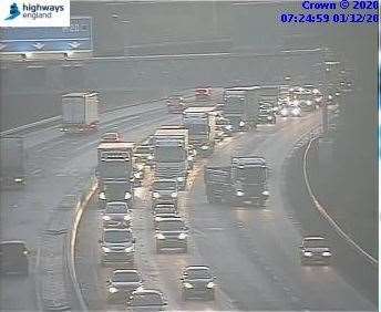 A stranded vehicle on the M20 near Snodland turning is leading to slow traffic building after the M26 junction