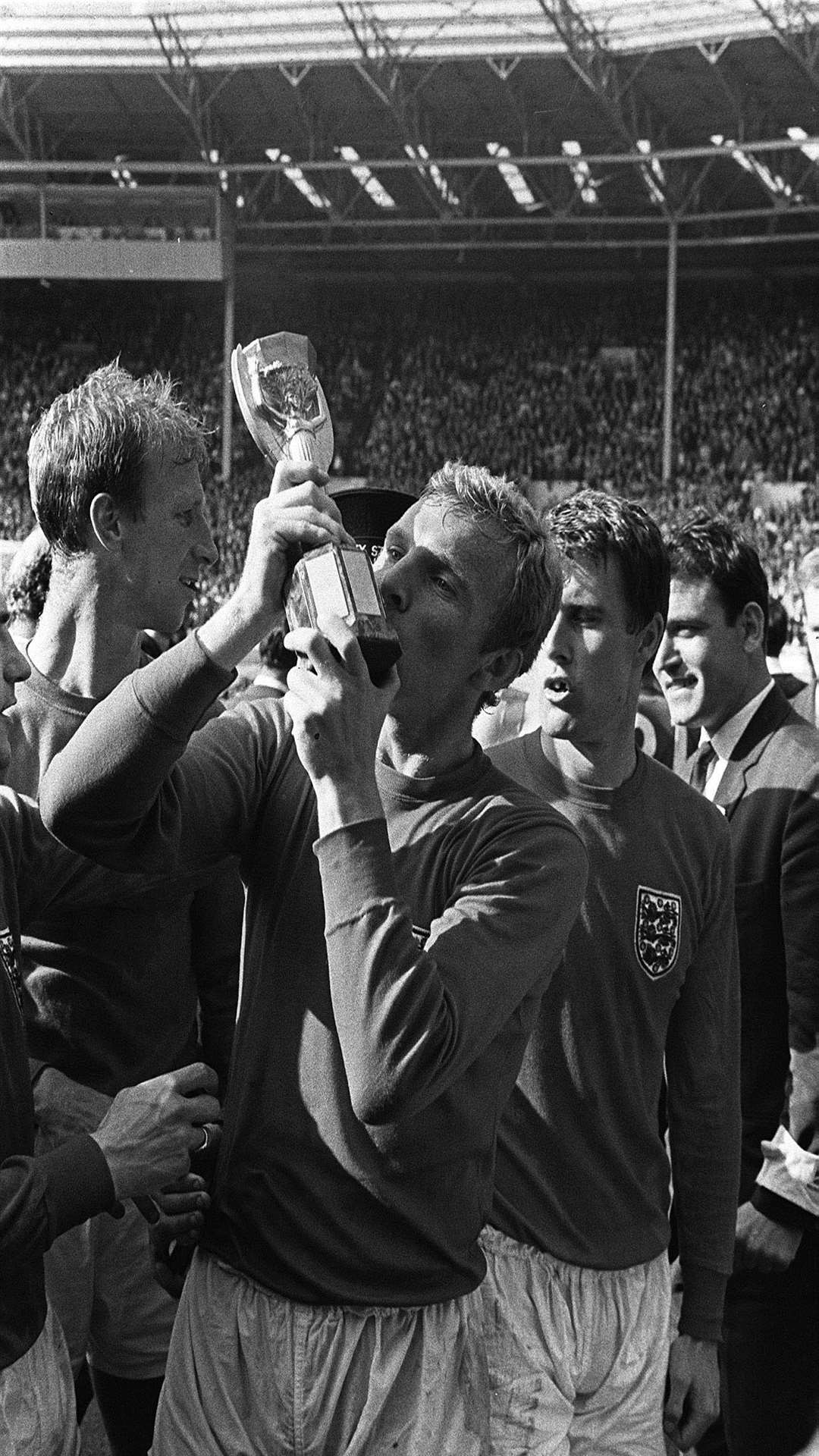 Bobby Moore planting an enthusiastic kiss on the World Cup trophy