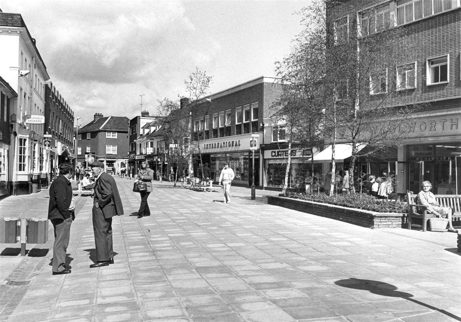 The Upper High Street in Ashford was home to the International Stores supermarket, a popular destination for shoppers when this 1977 shot was taken. But it was demolished to create the entrance to the Park Mall shopping centre. Picture: Images of Ashford by Mike Bennett