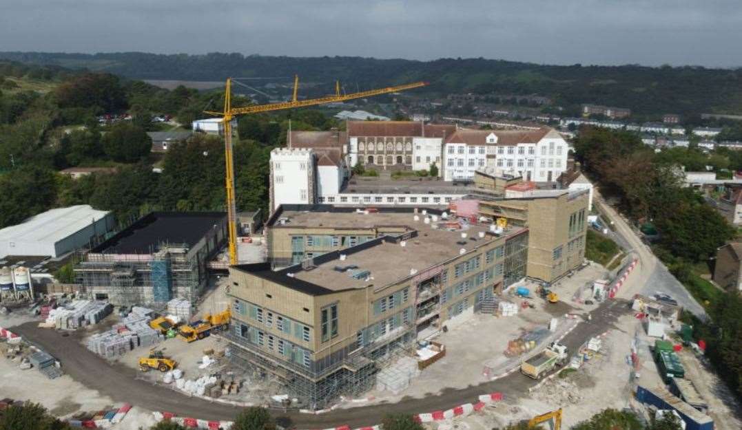 The new building under construction in September 2021 with the one it replaces behind it. Picture: Janik F Dover Grammar School for Boys
