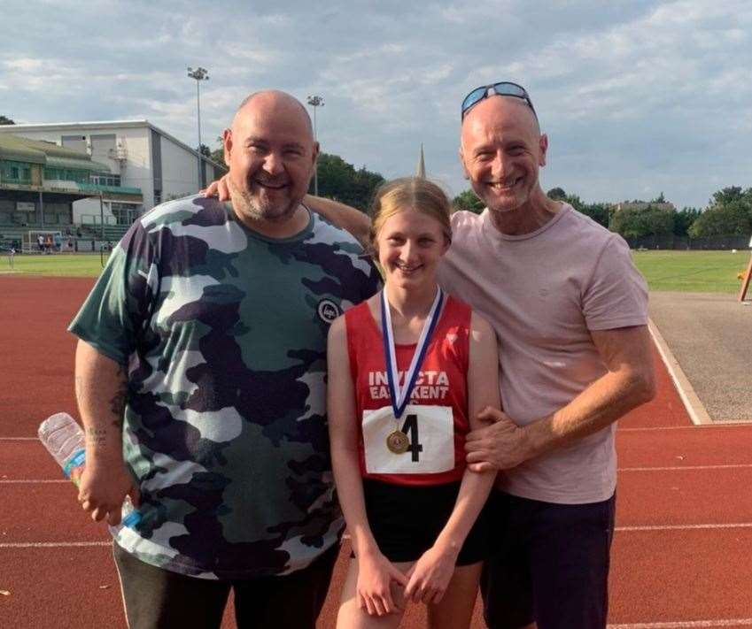 Three-time medalist Gracie Lawton with coach and dad
