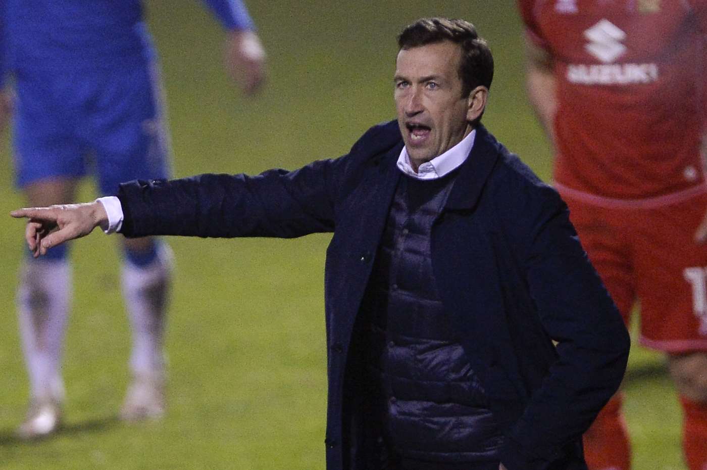 Gills boss Justin Edinburgh shouts encouragement from the sidelines Picture: Ady Kerry