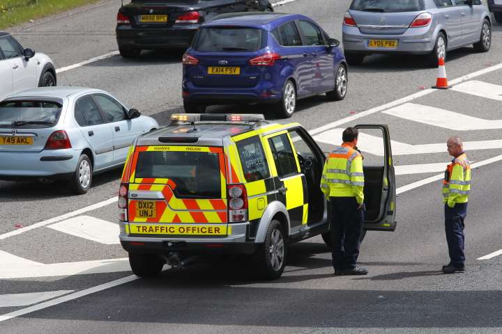 Traffic officers at the scene. Picture: Andy Jones