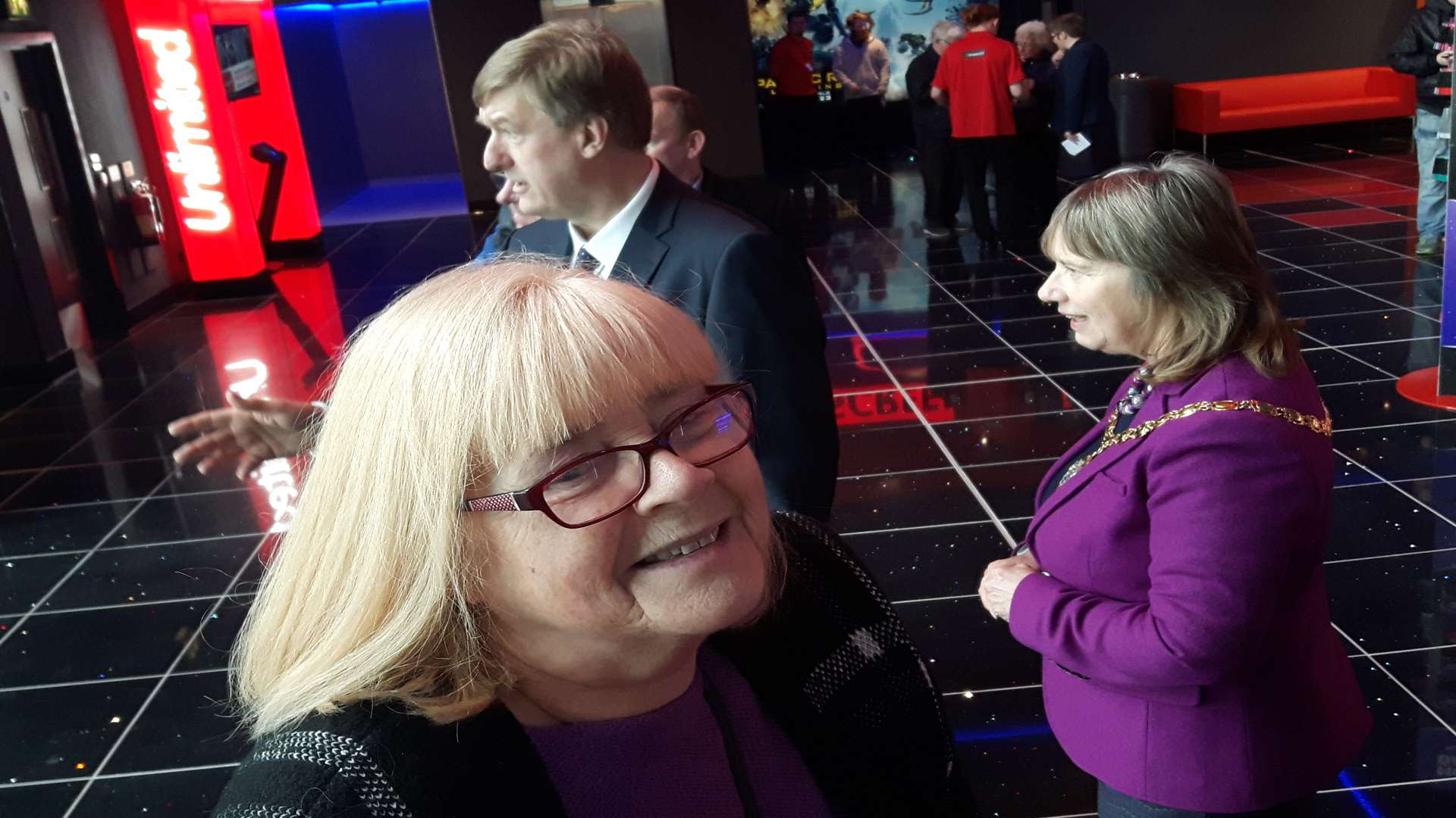 First cinemagoer. Val Ruthvens with council leader Keith Morris and chairman Sue Chandler in the background.