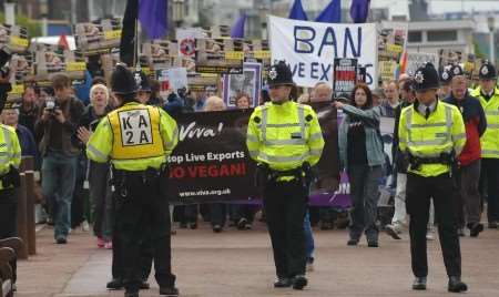 Campaigners march along the seafront in protest at the first shipment a fortnight ago. Picture: MATTHEW McARDLE