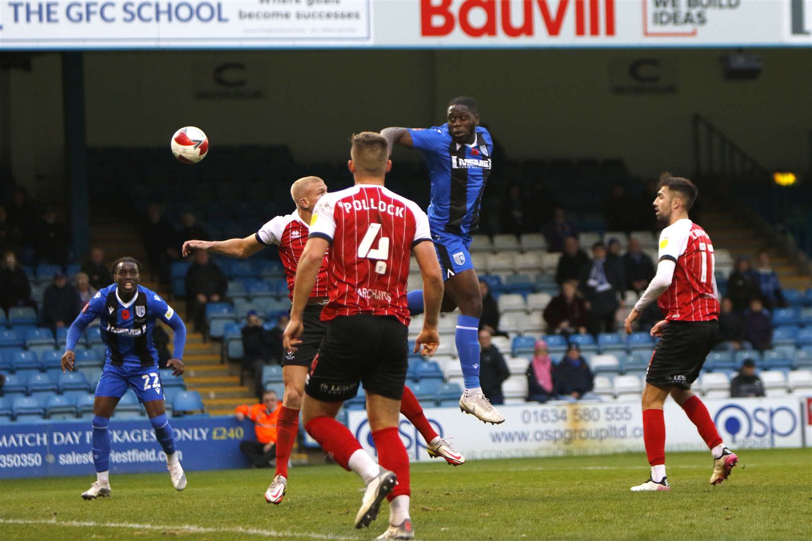 John Akinde challenges for the ball against Cheltenham Picture: Andy Jones