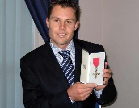 JONES WITH HIS MBE: "...there were times she couldn’t bear to watch". Picture: MARK PENNELL