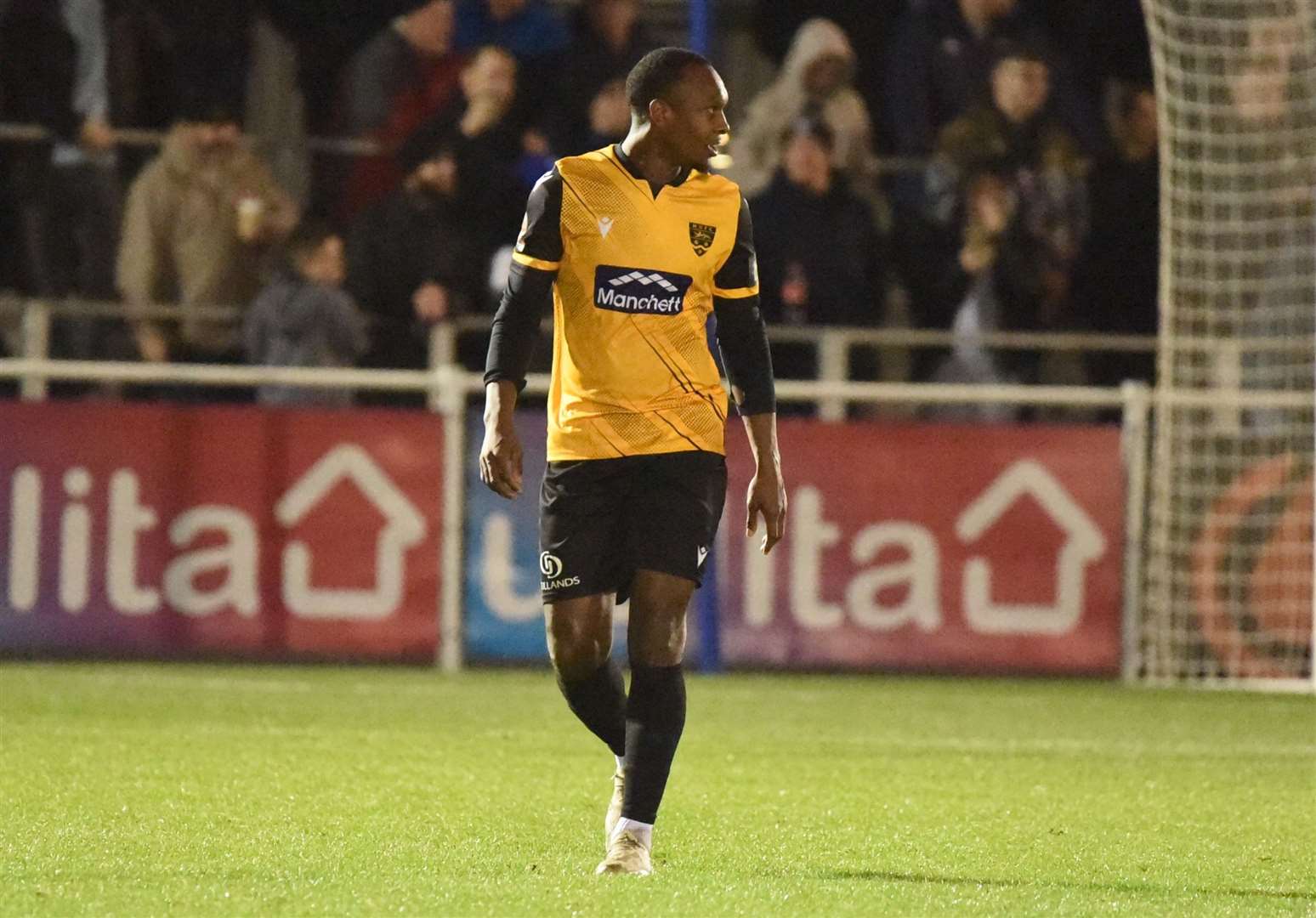 Gavin Hoyte leaves the field after his red card. Picture: Steve Terrell