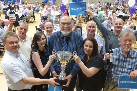 Medway Mail are presented with the Maidstone KM Big Charity Quiz Trophy by event sponsors DSH, MHA Macintyre Hudson and Qube recruitment.