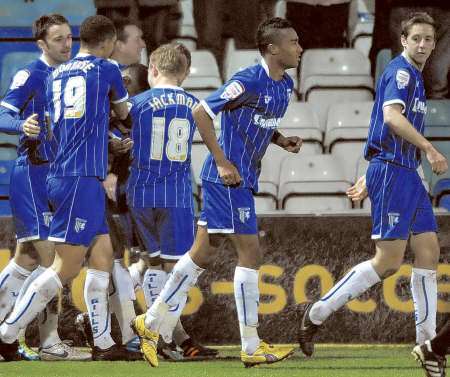 Gills players celebrate their second goal