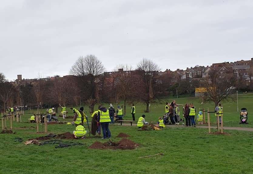 Volunteers planting trees as part of the huge planting scheme