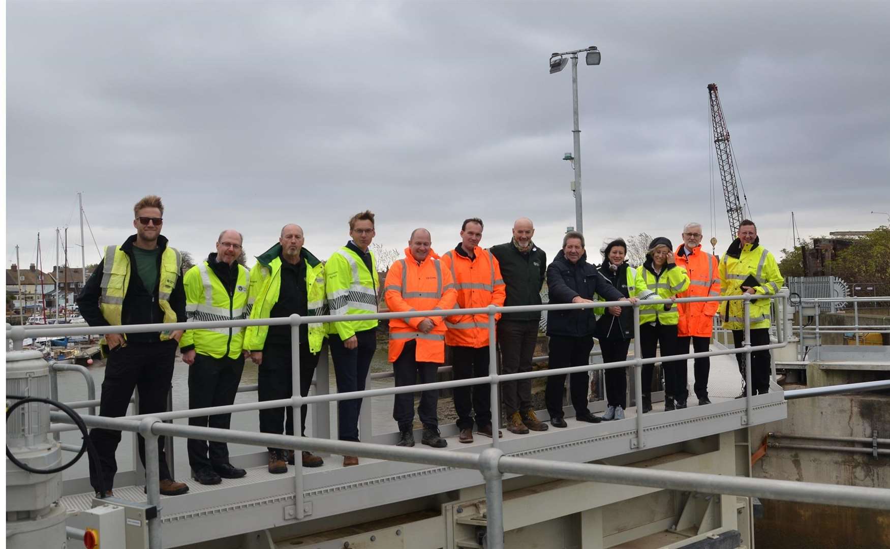 Environment Agency officers and MP Gordon Henderson at the new Queenborough harbour gates. Picture: Environment Agency