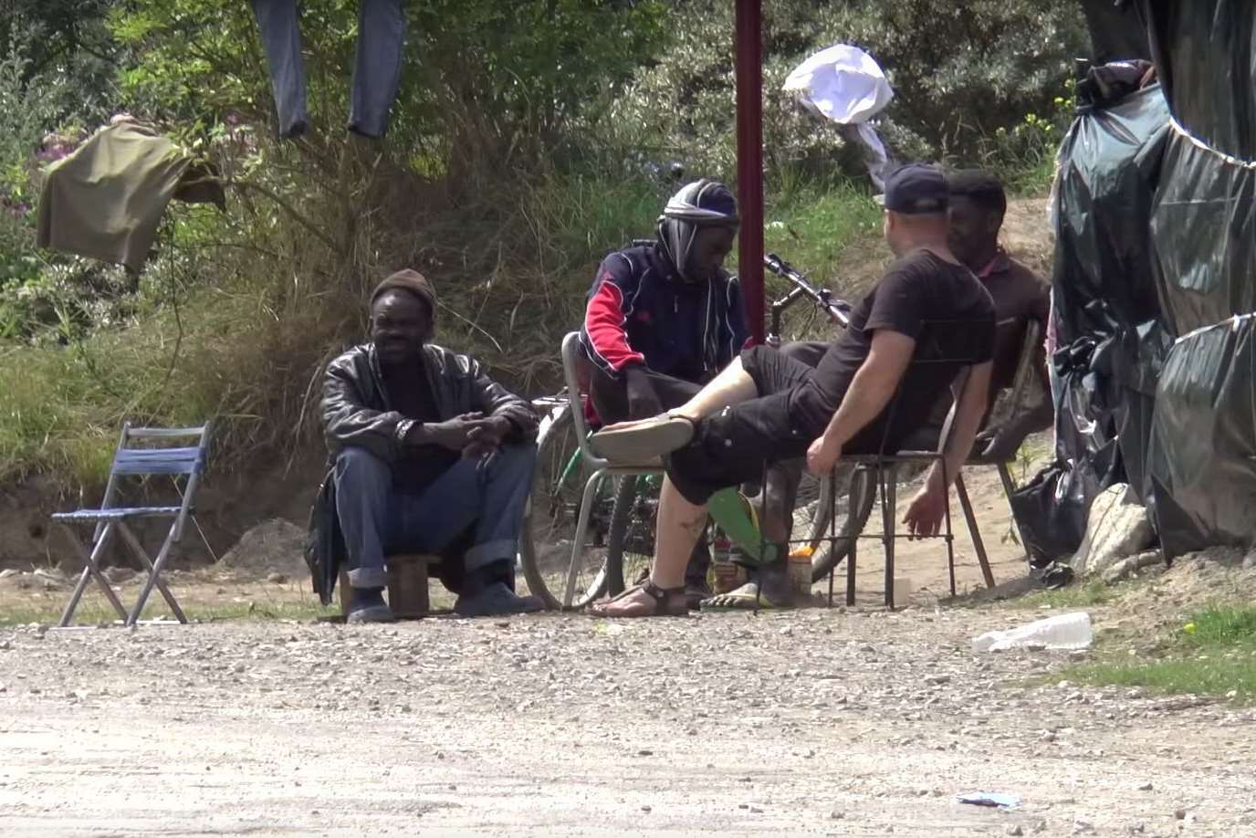 Migrants at the camp in Calais, near the Eurotunnel terminal
