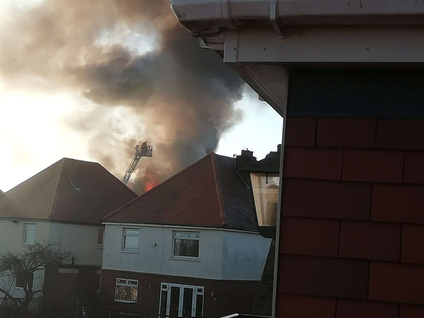 Firefighters remain at the scene. Picture: Julie Hollis