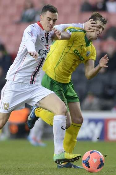 Dover's Tom Murphy is held back against MK Dons during their FA Cup Second Round clash. Picture Martin Apps