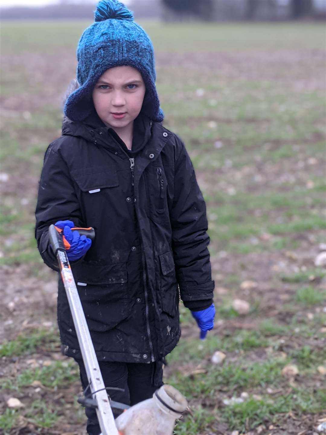 Charlie Hammell, nine, on his clean-up operation