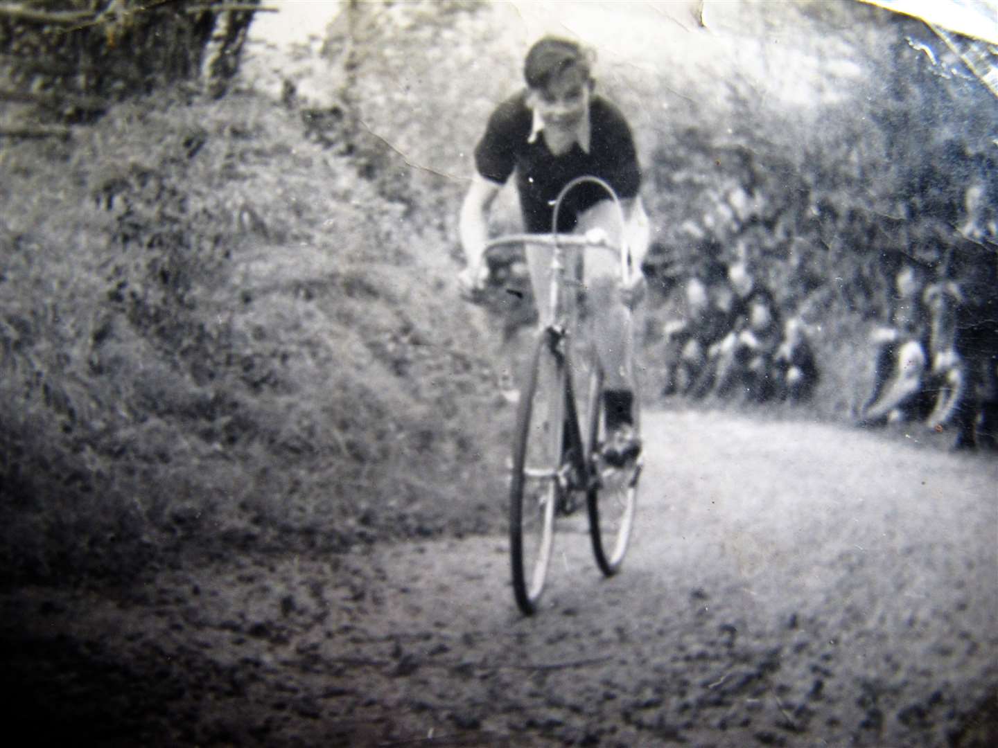 A teenage Peter Andrews racing his bike