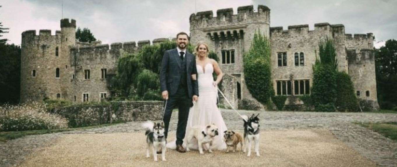 Emma and Jason pictured on their wedding day with their four dogs Ozzy, Little Mo, Albie and Arlo