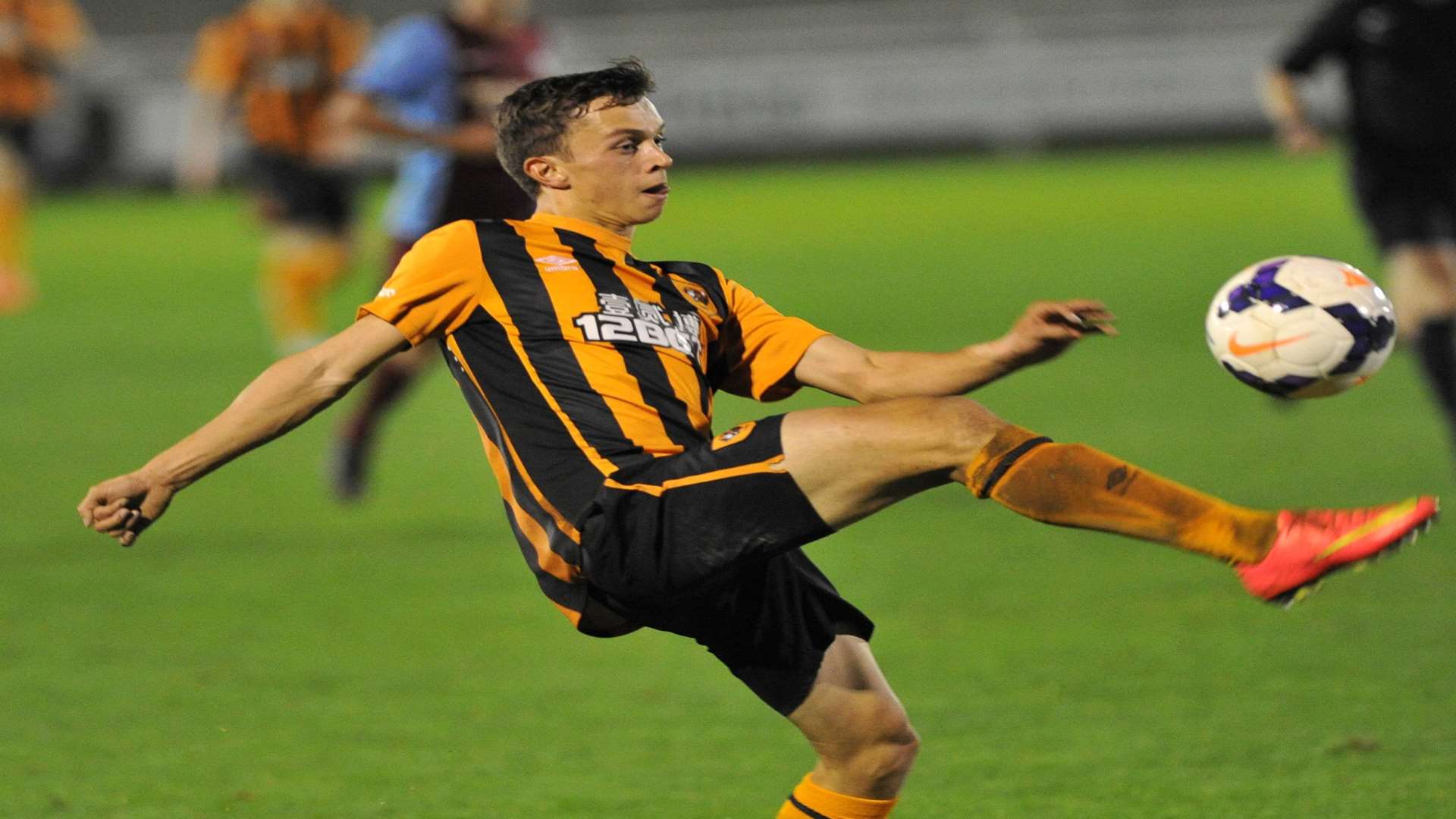 Hull's Johan ter Horst helps the ball on with his right foot
