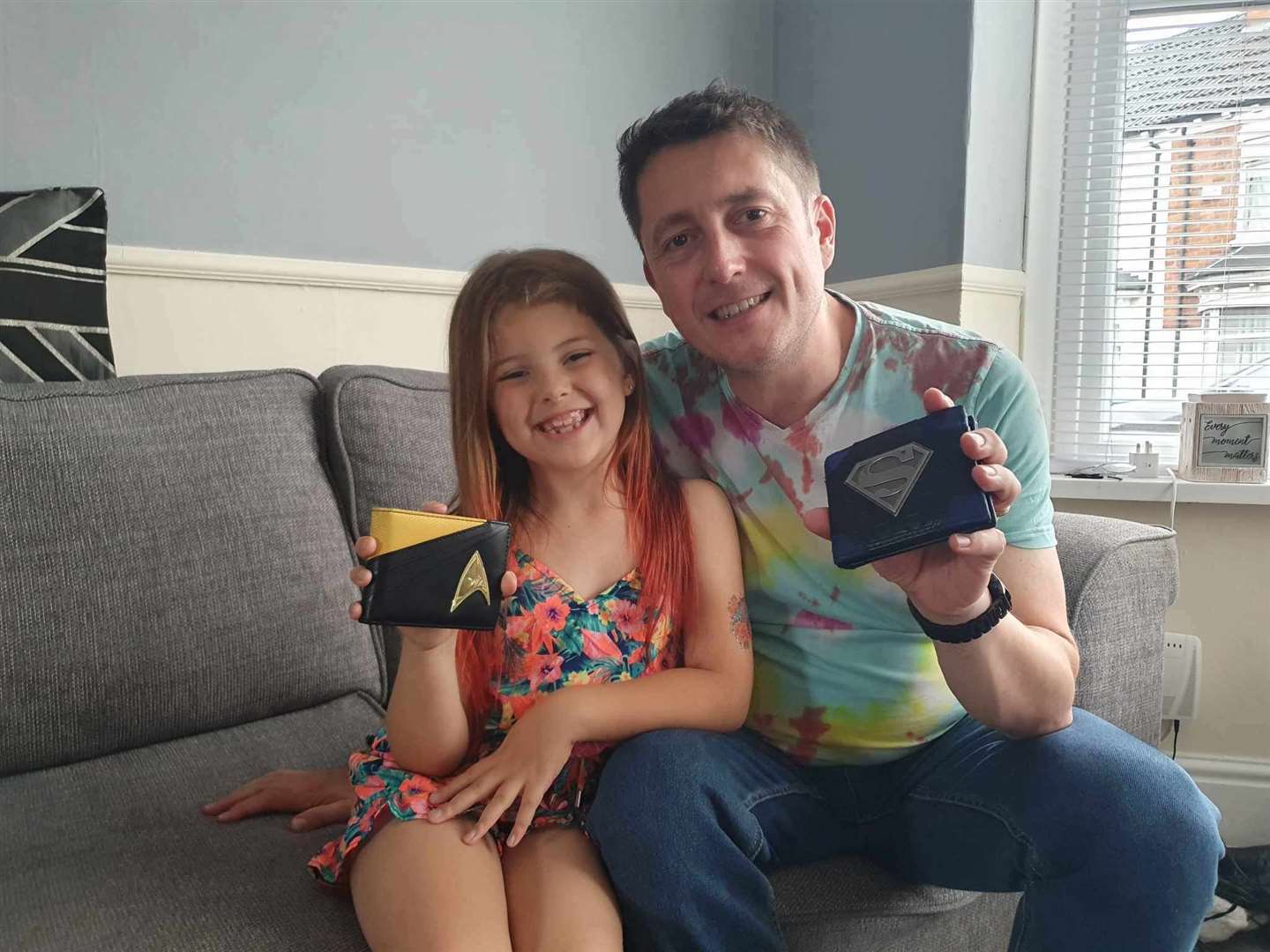Kelvin and his daughter Sarah with the wallet he lost and the replacement. Picture: Kelvin Walker