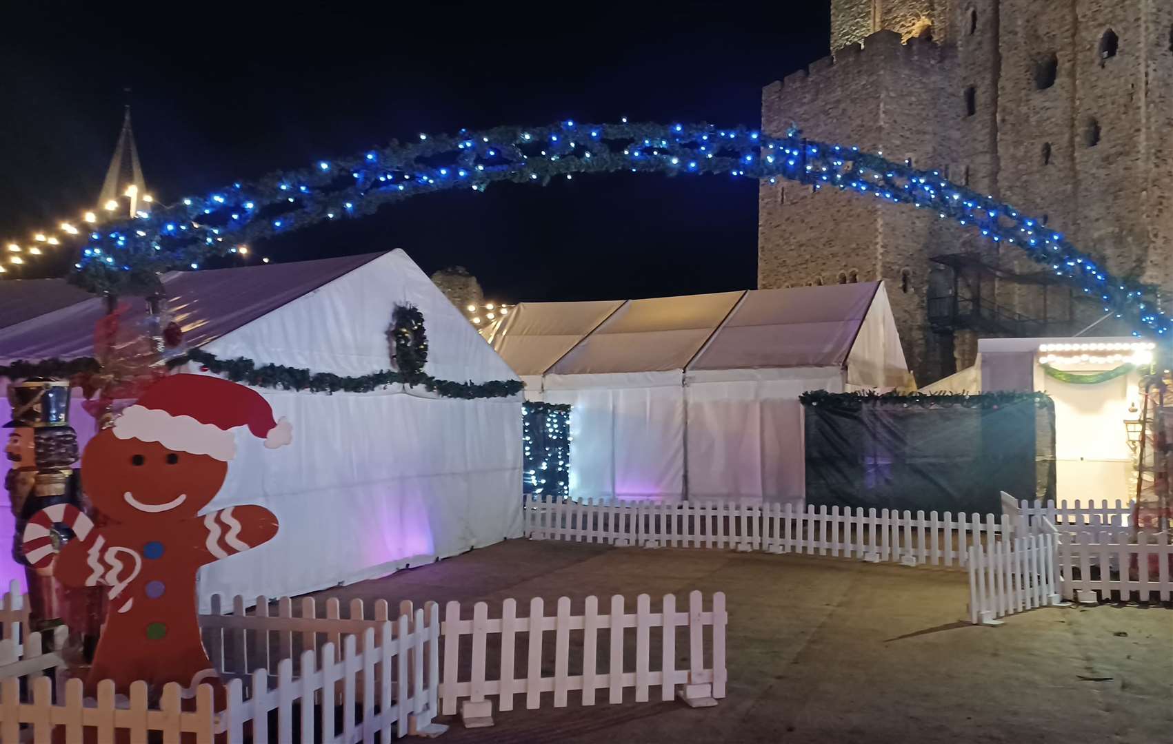 The Christmas Village is nestled between the market stalls in Rochester Castle Gardens