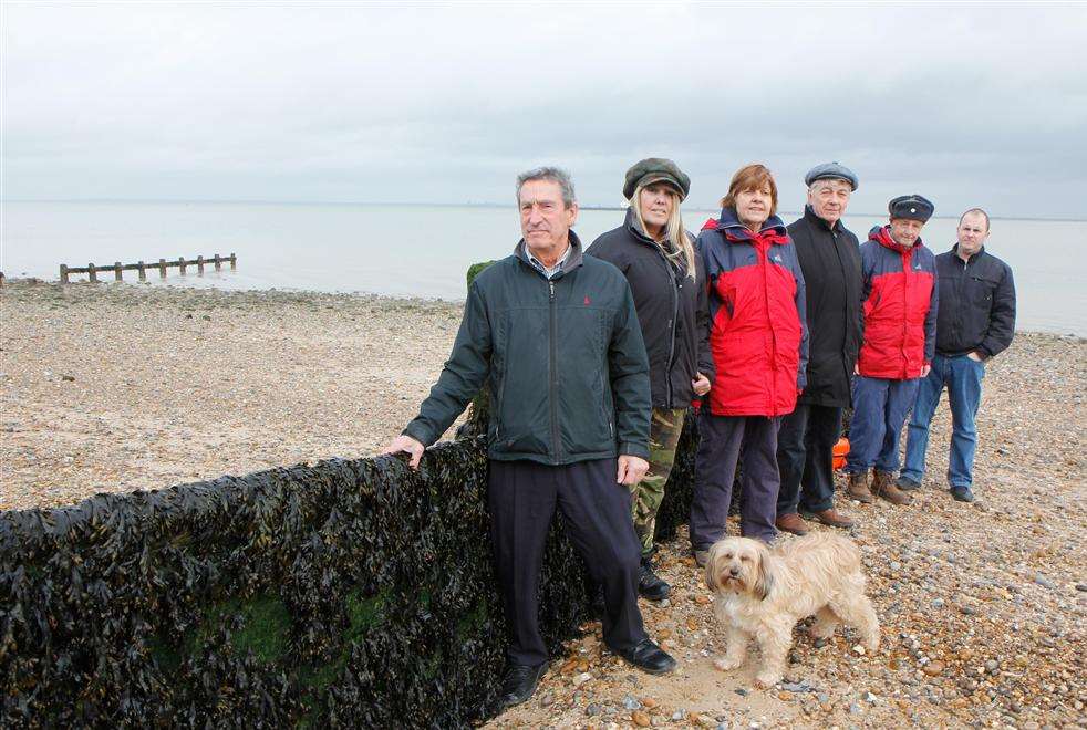 Members of the Sheppey Coastal Protection Group next to the groynes.