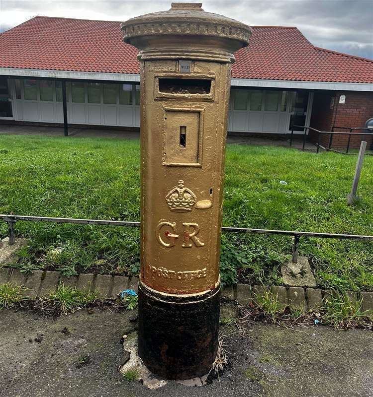 Post box painted gold in Watling Street in Dartford