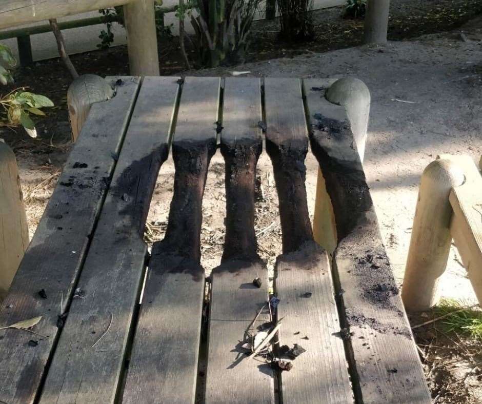 A picnic table in the Lower Leas Coastal Park was damaged after people had a BBQ. Picture: Folkestone & Hythe District Council