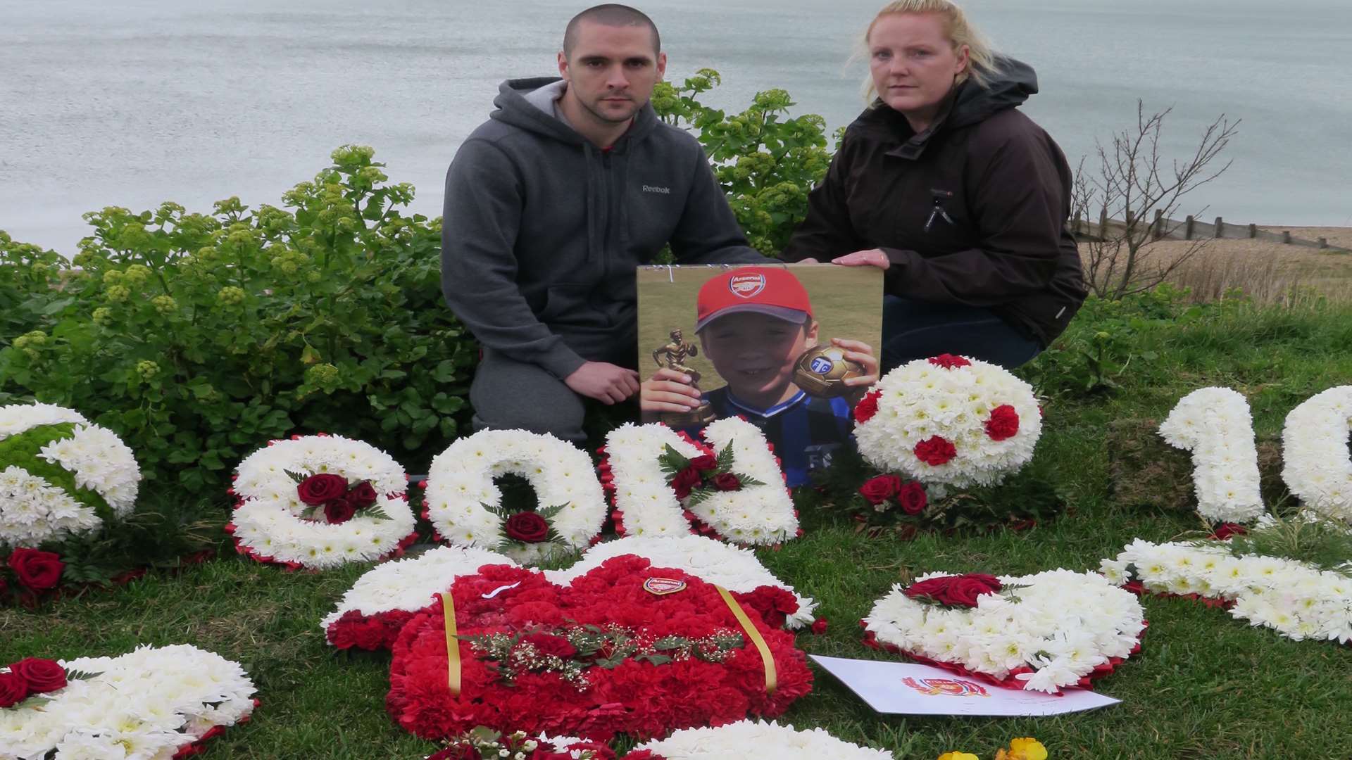 Murad and Caroline Yanik with the floral tributes to their son, Bailey