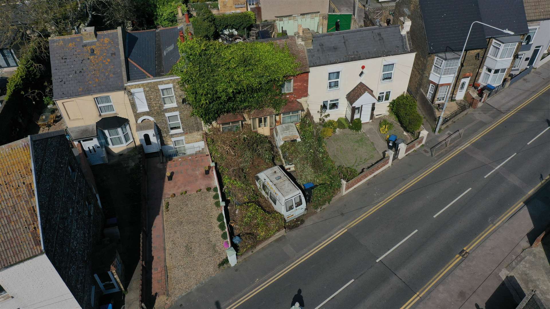 New images show work has started to cut back the shrubs that had covered the home in Boundary Road, Ramsgate. Picture: UKNIP