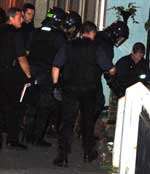 Police raid an address in Folkestone as part of the operation